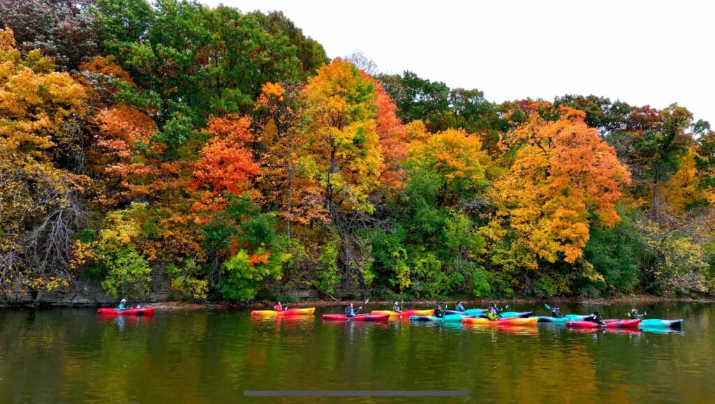 Best places to kayak near Chicago on the Fox River with kayakers enjoying peak fall foliage